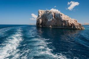 a large rock in the middle of the water at Robinson House Zut (3467) in Bizikovica