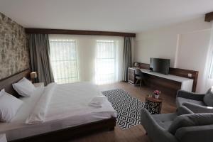 Postel nebo postele na pokoji v ubytování Avwan Hotel Çiğli