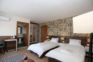 Postel nebo postele na pokoji v ubytování Avwan Hotel Çiğli
