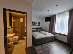 Ein Bett oder Betten in einem Zimmer der Unterkunft Hotel Aleo