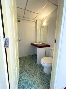 a bathroom with a toilet and a sink at MANGO Lagoon Place in Bangkok