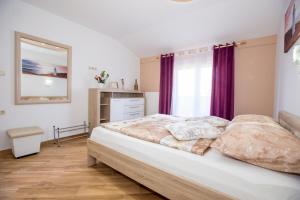 Posteľ alebo postele v izbe v ubytovaní House Lopar (73)