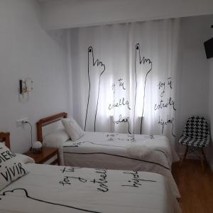 Posteľ alebo postele v izbe v ubytovaní Hostal "Los Chanos el Ruso"