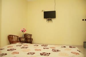 Televizorius ir (arba) pramogų centras apgyvendinimo įstaigoje Hotel Milik Kita Syariah