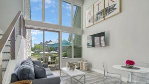 a living room with a couch and a table at The Surf Club Resort in Montauk