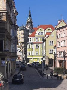 a city street with many buildings and cars parked at Apartament Stara Kamienica 1930r. in Kłodzko