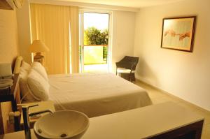 a hotel room with a bed and a window at Babylon Luxury Villa with Private Pool and indoor Heated Pool in Side