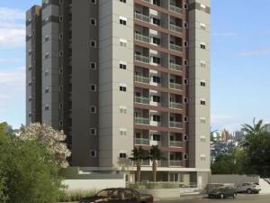 un edificio de apartamentos alto con coches estacionados frente a él en BALI - PAZ & CONFORTO COM WIFI e VAGA,Máx4 pessoas en São Carlos