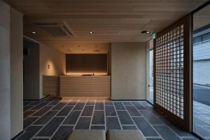 a room with a projection screen in a building at Stay SAKURA Kyoto Gion Miyagawacho in Kyoto