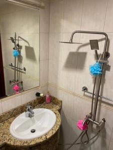 a bathroom with a sink and a mirror at Beachfront Property With Atlantis The Palm & Skydive View In Dubai Marina in Dubai