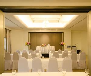 a large room with white chairs and a table in it at Lanna Palace 2004 in Chiang Mai +37 photos
