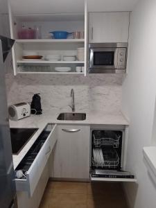 A kitchen or kitchenette at Rosesapparts Gran Via