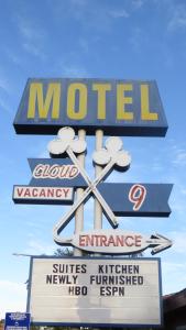 a sign for a motel with a sign for at Cloud 9 in Cypress