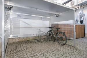 a bike is parked in a garage at Hotel Wohnbar in Bamberg
