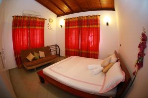 Postel nebo postele na pokoji v ubytování Colombo Orchid Villa