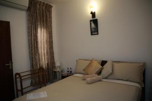 Postel nebo postele na pokoji v ubytování Colombo Orchid Villa