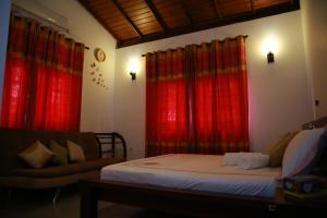 Postel nebo postele na pokoji v ubytování Colombo Orchid Villa + 30 fotografií