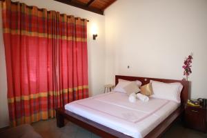 Postel nebo postele na pokoji v ubytování Colombo Orchid Villa