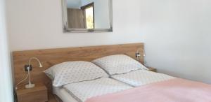 Llit o llits en una habitació de apartman SUPERKLASIKO