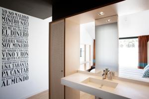 a bathroom with a sink and a mirror at TOC Hostel Barcelona in Barcelona