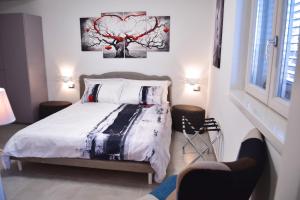 Postel nebo postele na pokoji v ubytování B&B GDA