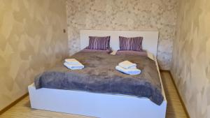Ein Bett oder Betten in einem Zimmer der Unterkunft J&E NEMUNO Apartment II