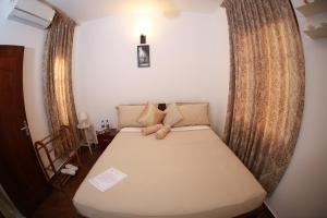 Postel nebo postele na pokoji v ubytování Colombo Orchid Villa