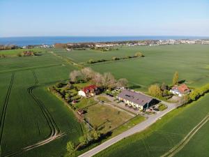 an aerial view of a house in a field at Ferienhof am Leuchtturm mit Meerbl in Kägsdorf