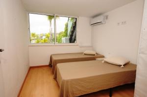 En eller flere senge i et værelse på Albufeira Villa Okapi