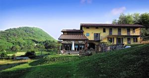 a house on the side of a hill at Cascina Canée in Angera