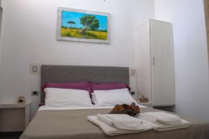Voodi või voodid majutusasutuse Baia Di Torre Squillace toas
