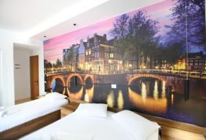 Postel nebo postele na pokoji v ubytování Ksamil Central Park Hotel