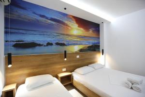 Postel nebo postele na pokoji v ubytování Ksamil Central Park Hotel