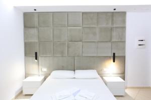 Postel nebo postele na pokoji v ubytování Ksamil Central Park Hotel