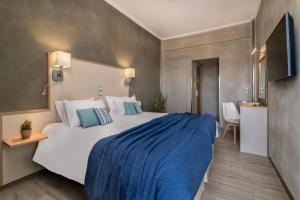 Postel nebo postele na pokoji v ubytování Phoenix Hotel