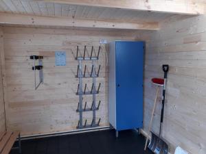 a room with a blue door and shelves in it at Winterberg Chalet 21096 in Winterberg