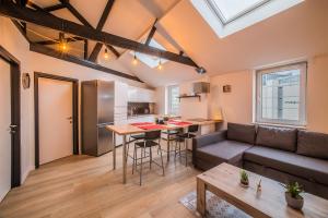 a living room with a couch and a table at Smartflats - Central Brussels in Brussels