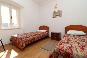 Ένα ή περισσότερα κρεβάτια σε δωμάτιο στο Apartment Lepur Slano +33 φωτογραφίες