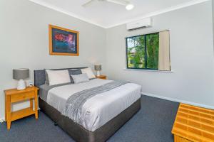 A bed or beds in a room at Comfort Inn & Suites Karratha