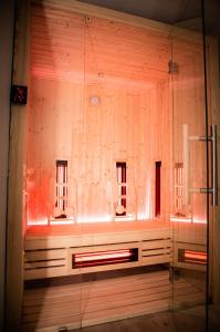 a bathroom with two sinks and a glass wall at Zajazd Bombonierka in Wikno