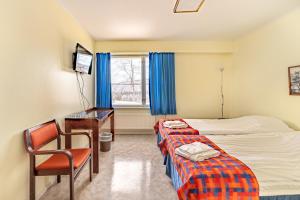 Postel nebo postele na pokoji v ubytování Hotel Utsjoki