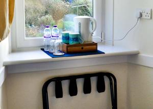 a window sill with bottles of water at An Cuan Bed & Breakfast in Bowmore