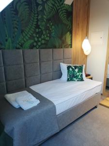 Ein Bett oder Betten in einem Zimmer der Unterkunft FOLGA - Hotel, Restauracja, Browar, SPA