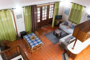 an overhead view of a living room with a piano at Adega do Pereirinha in São Roque do Pico