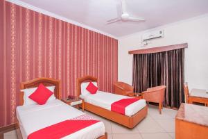 מיטה או מיטות בחדר ב-Hotel Chetan International