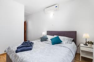 Postel nebo postele na pokoji v ubytování Villa Rožica
