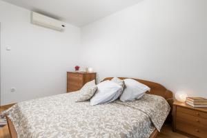 Postel nebo postele na pokoji v ubytování Villa Rožica
