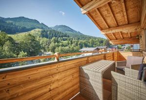 a balcony with a view of the mountains at Appartements Haus Alexander in Saalbach Hinterglemm