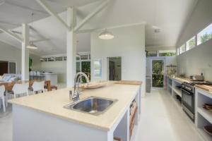 a kitchen with a sink and a counter top at Kangela 4 in Ponta Malongane