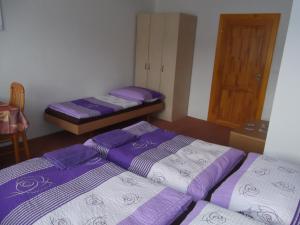 Postel nebo postele na pokoji v ubytování Penzion Apartmány Zlín